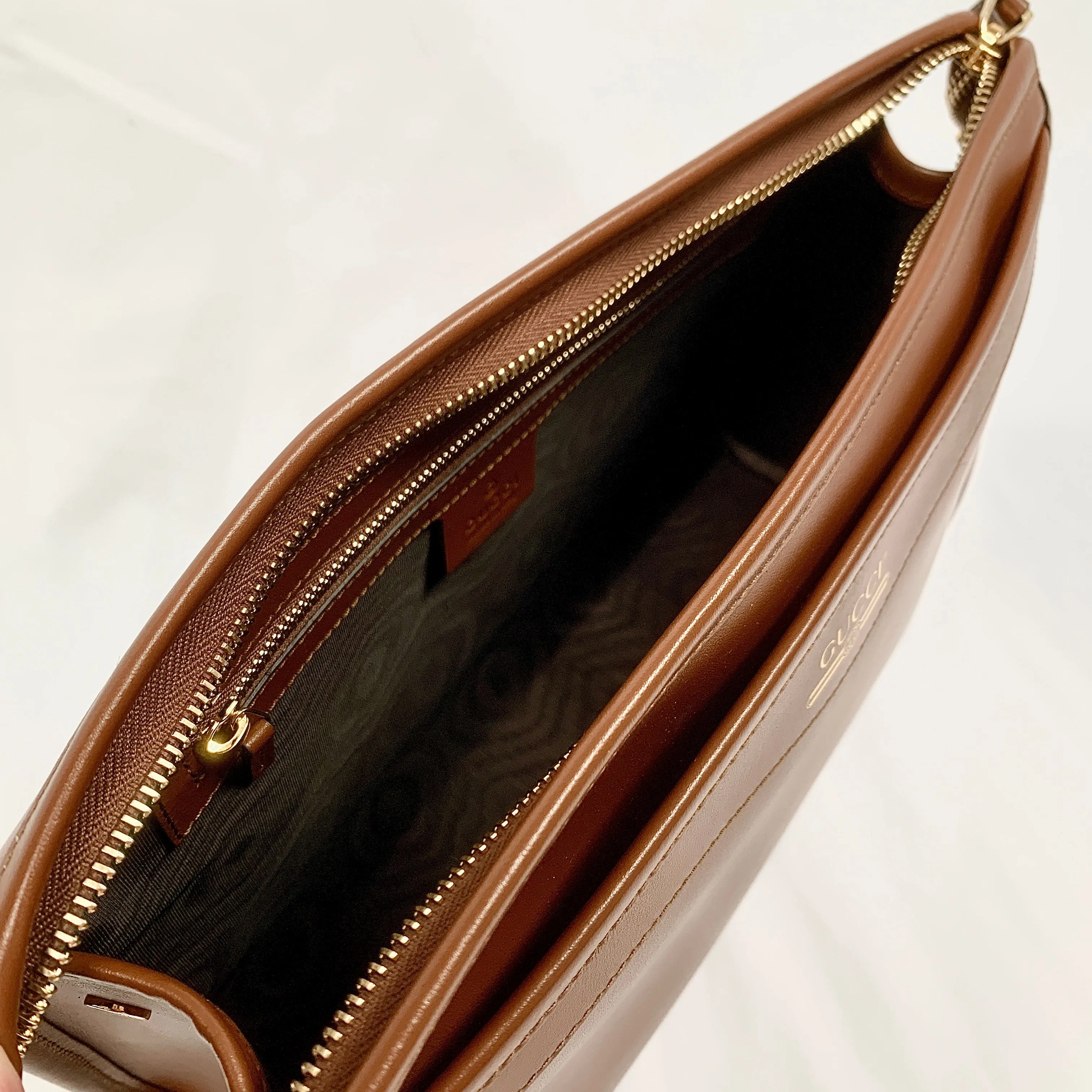 Gucci Metallic Print Logo Smooth Leather Clutch in Brown